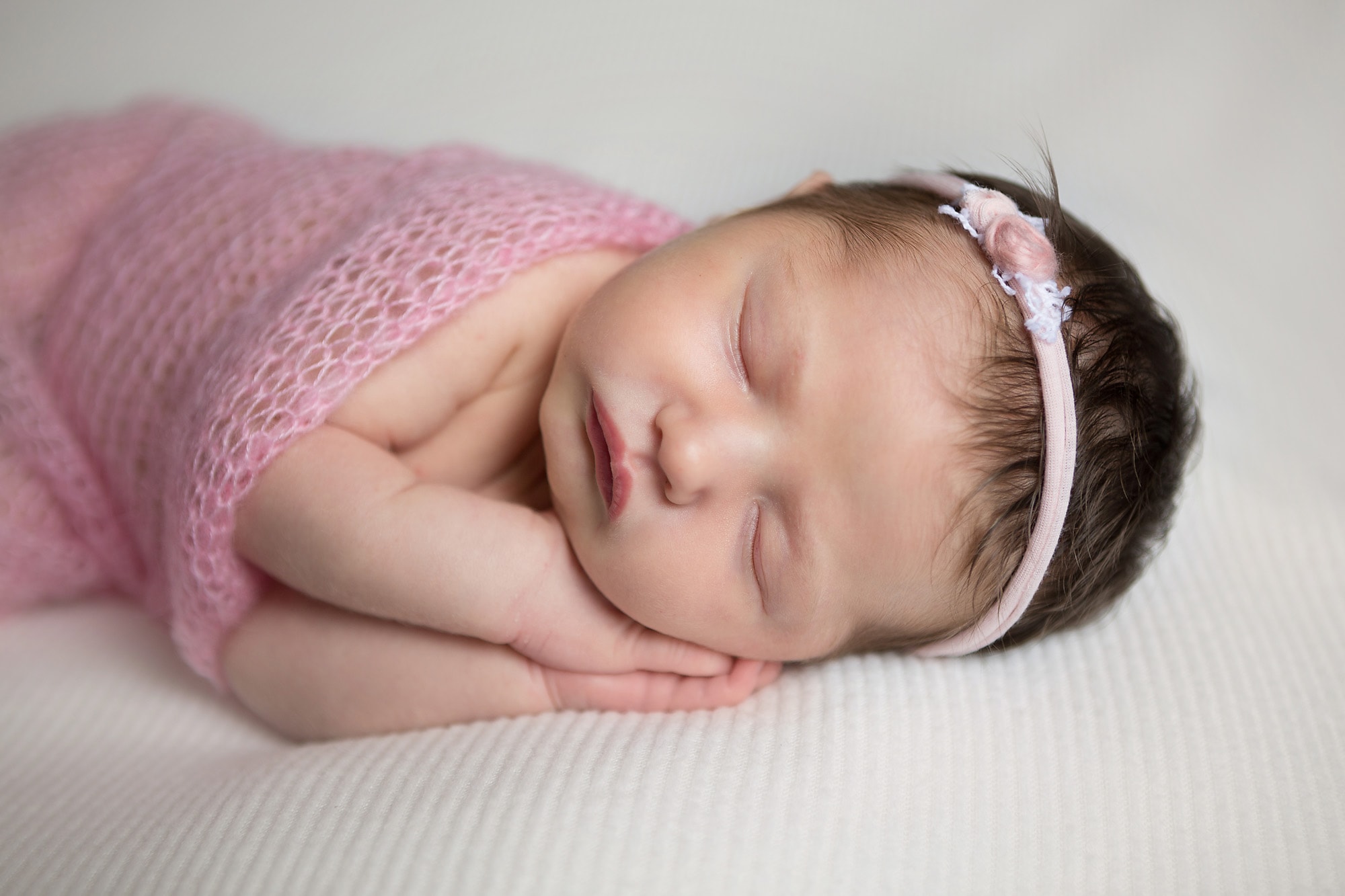 newborn portrait in pink baby girl close up in San Antonio