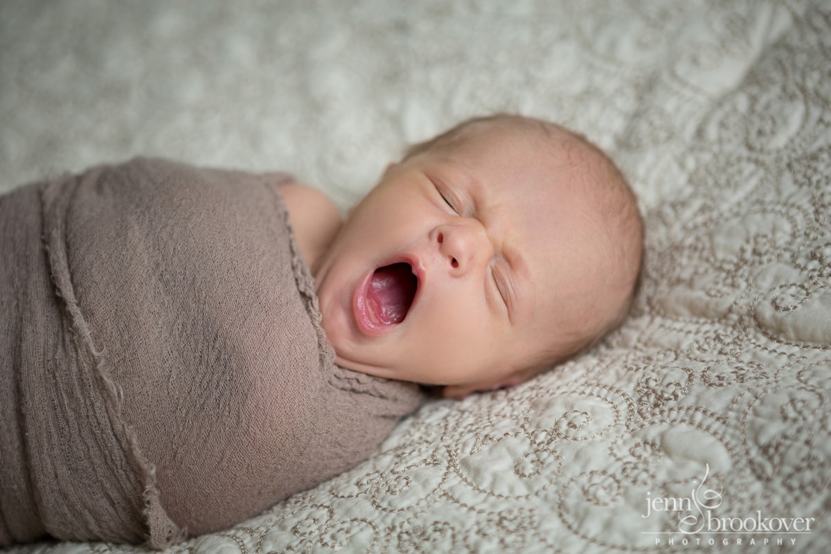 sweet baby yawns taken during newborn session in San Antonio by Jenn Brookover