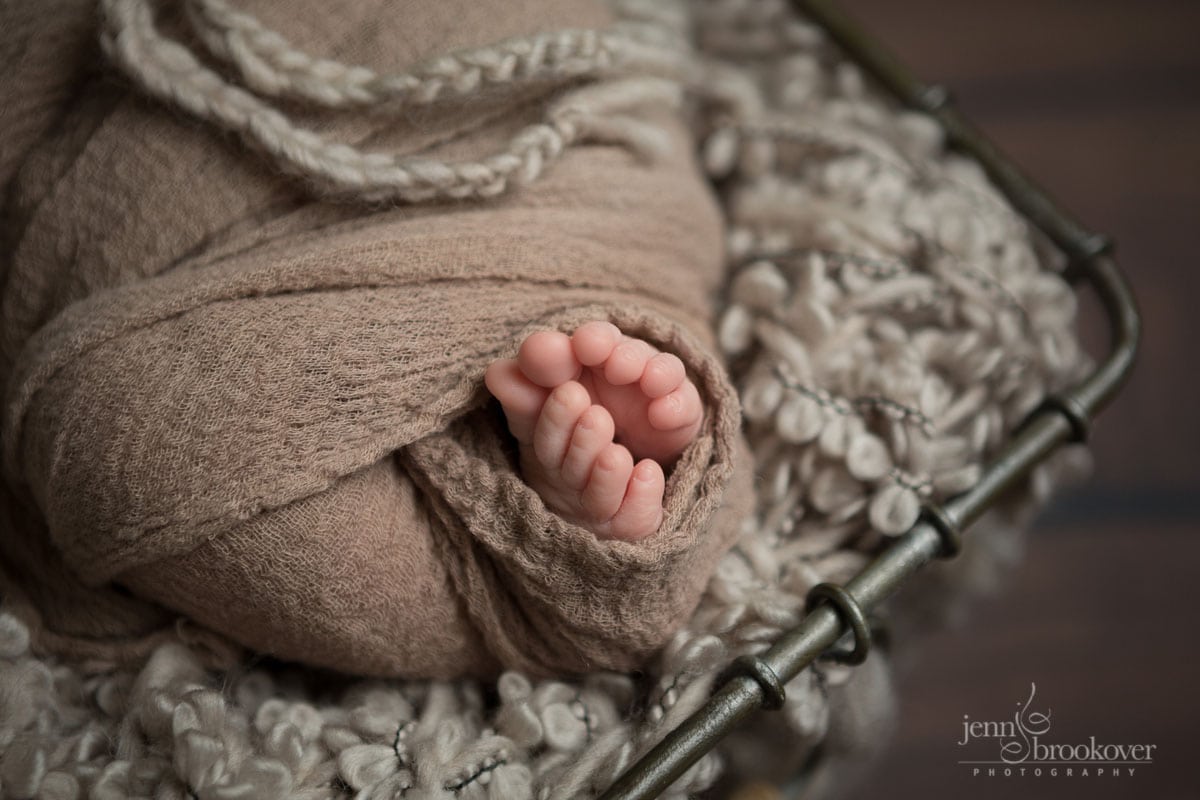 close up of baby toes in taupe wrap by Jenn Brookover Photography in San Antonio