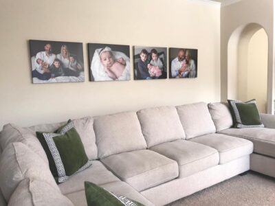 A living room with several pictures on the wall.