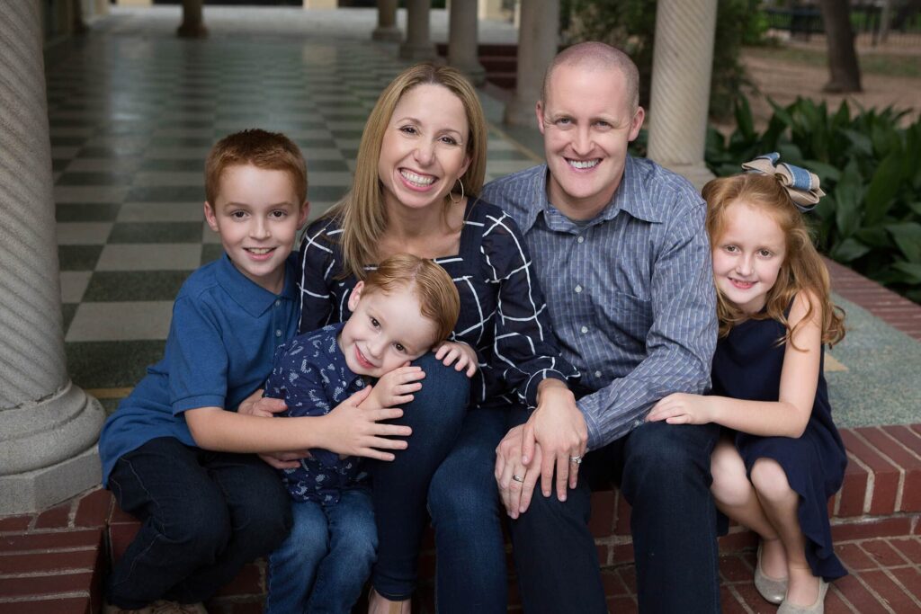 A family is posing for a family portrait.