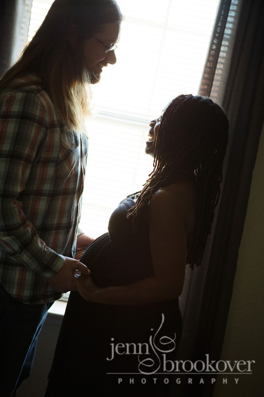 backlit image of San Antonio couple celebrating their pregnancy with maternity portraits by Jenn Brookover