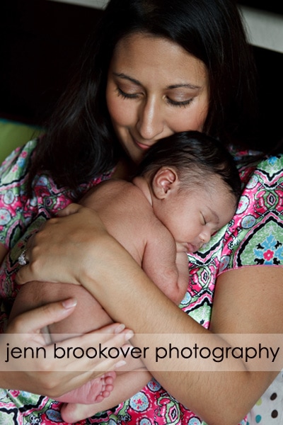 A woman is holding a baby, beautifully captured by Jenn Brookover Photography.