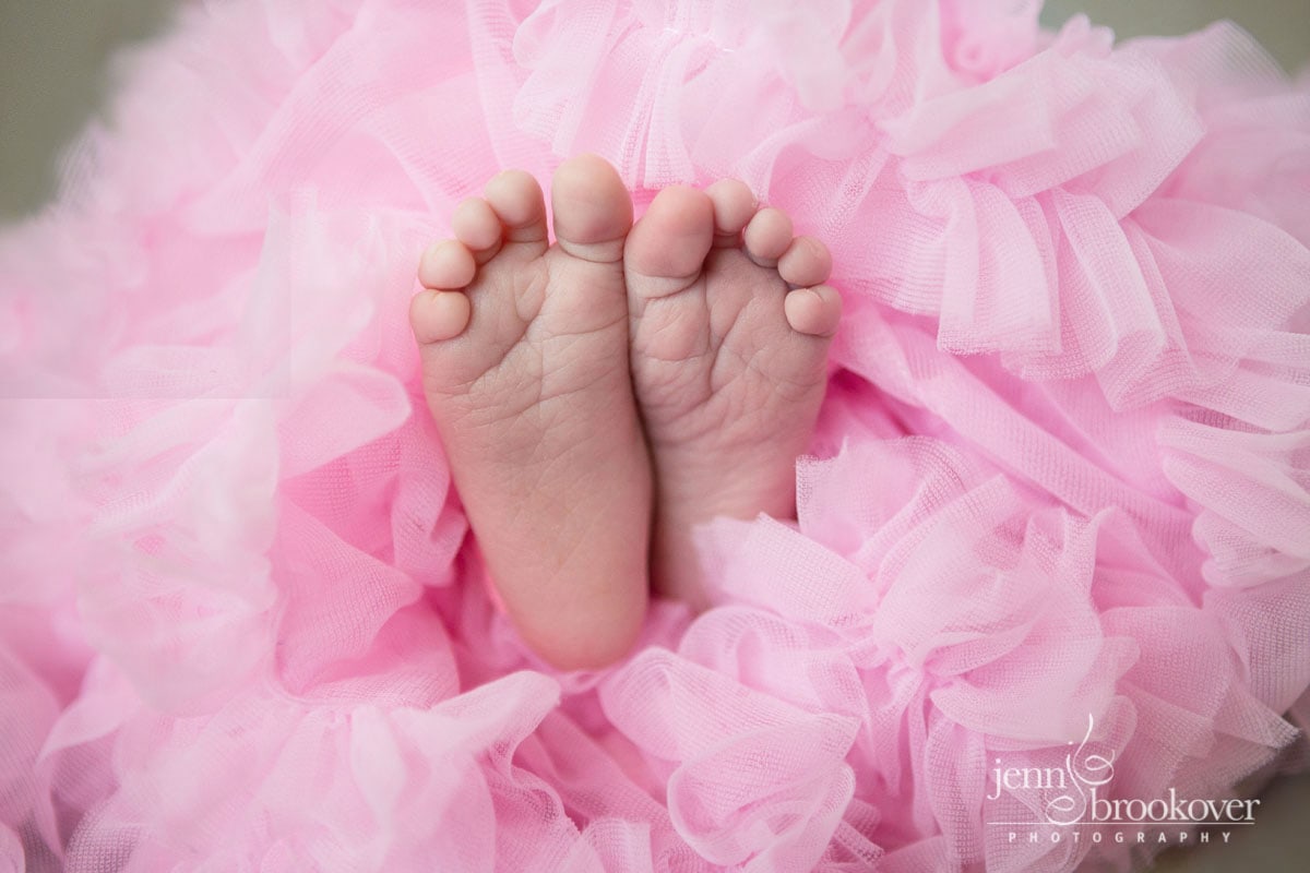 newborn photography at home in San Antonio, Texas, baby feet and a tutu