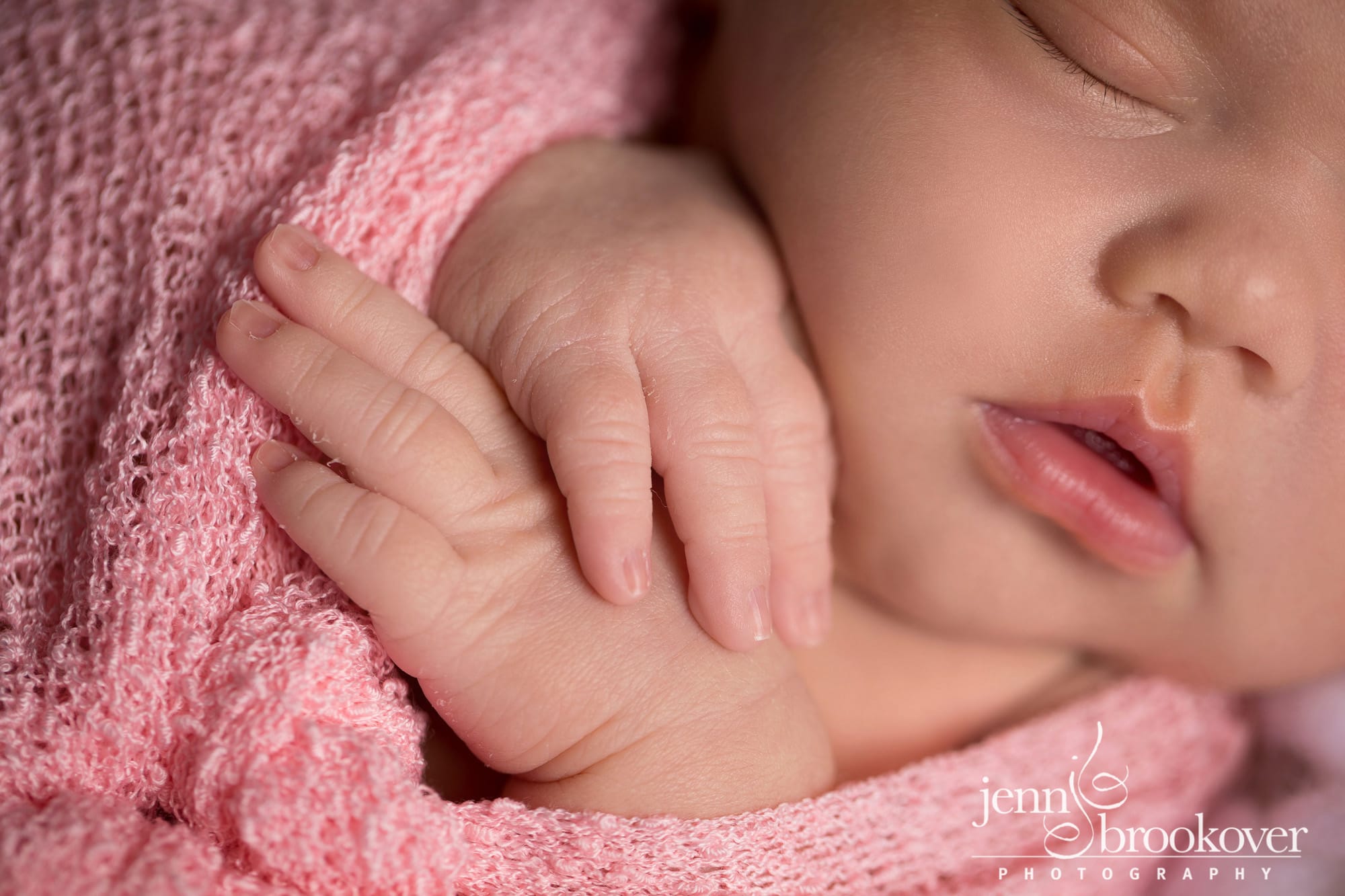 close up of baby hands with pink blanket by Jenn Brookover Photography in San Antonio, Texas