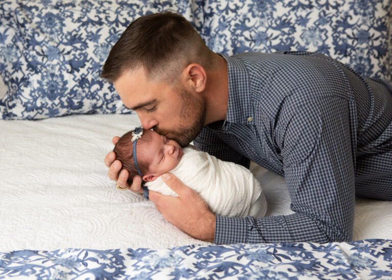 newborn with dad during photo shoot at home with Jenn Brookover photography in San Antonio, TX