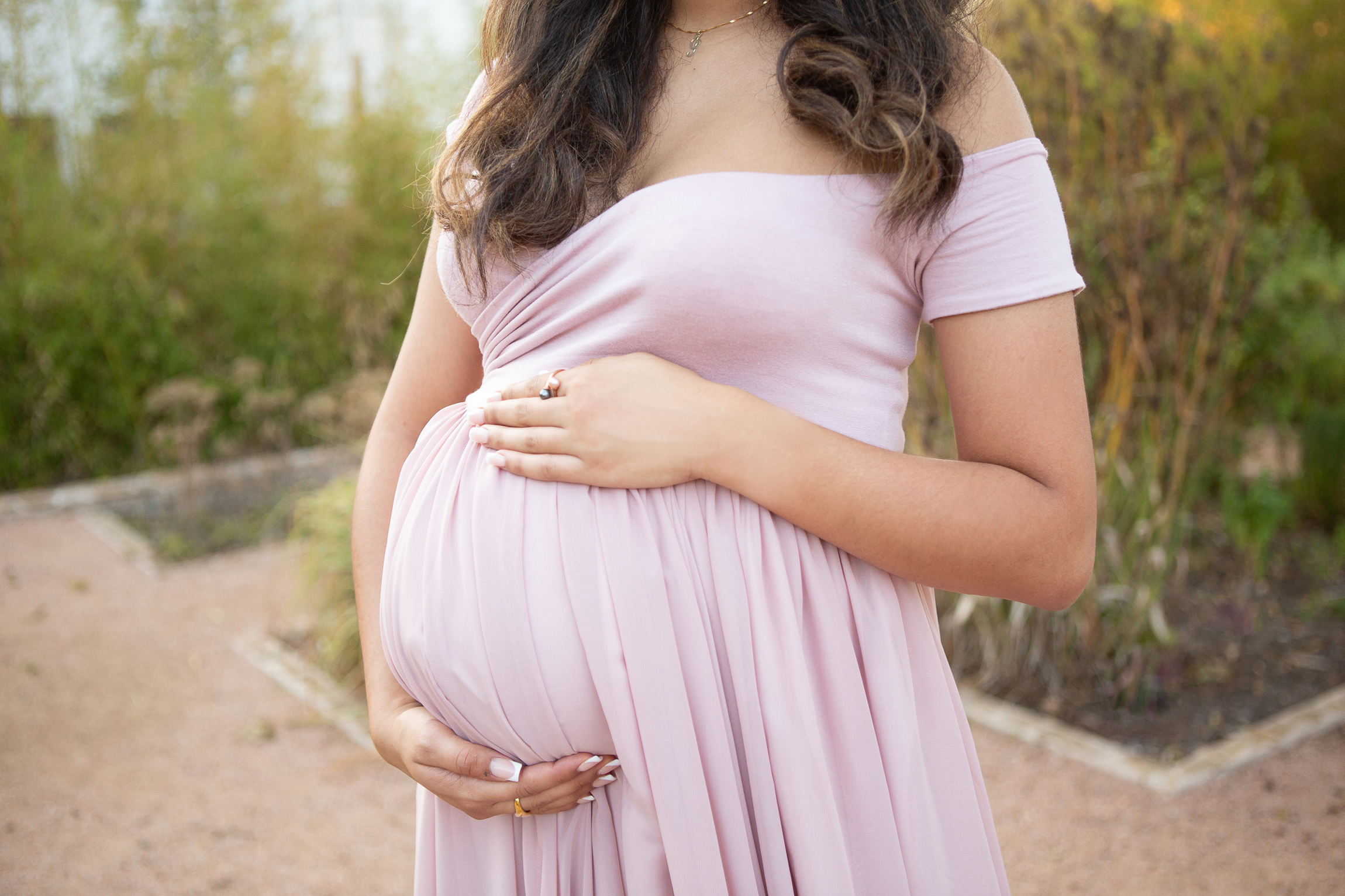 image of a pregnant woman expecting a baby during her maternity portrait session in San Antonio, Texas